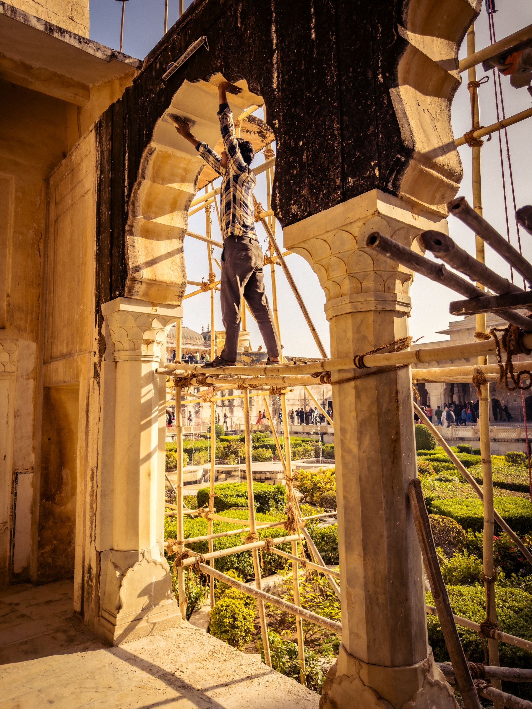 Stone Arches With Scaffolding And Worker